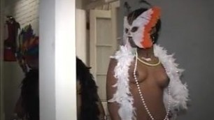 Black babe in mask flashes tits to crowd