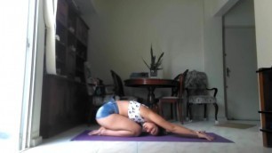 Pretty latin girl doing yoga